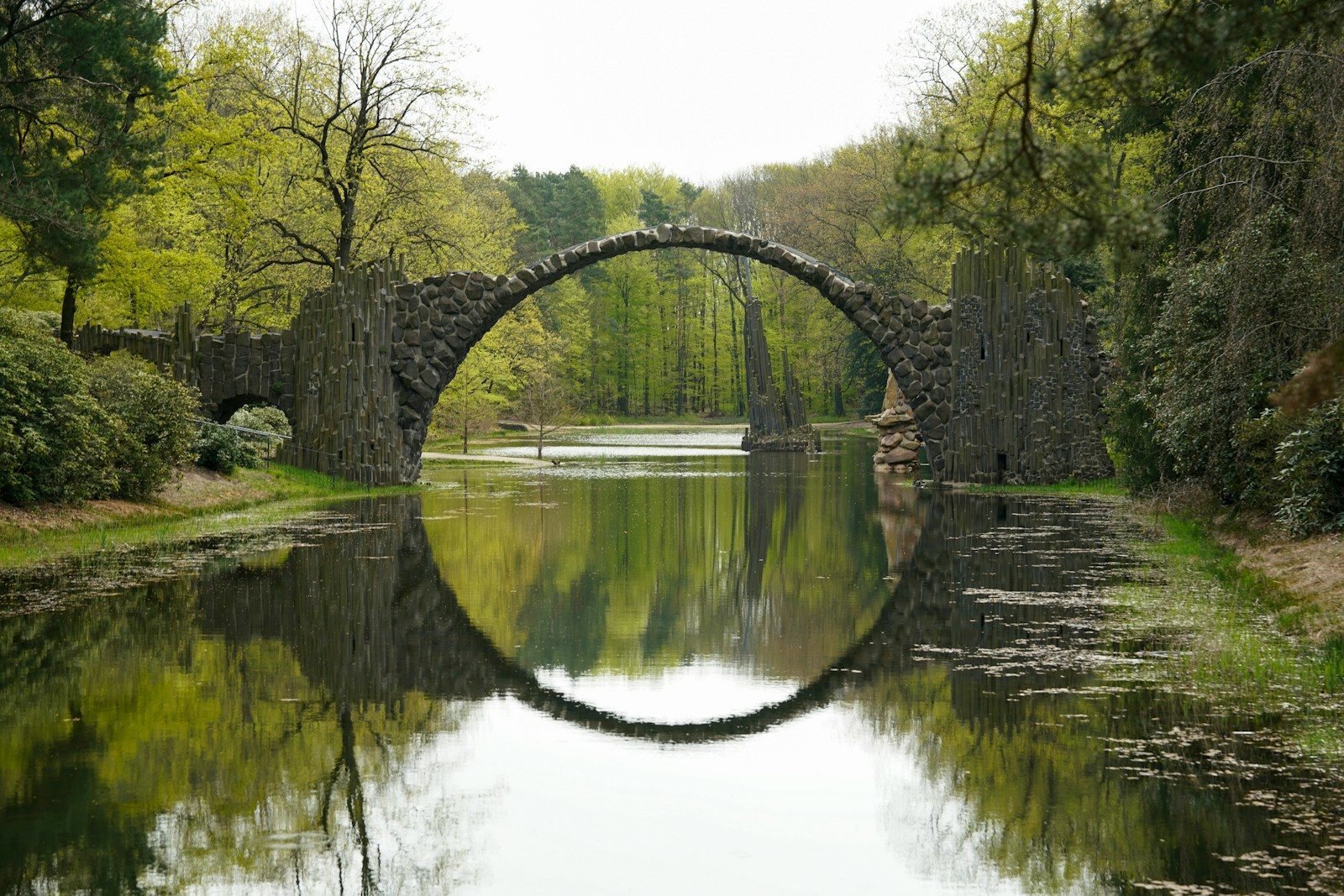A stone bridge over a body of water